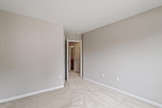107 Tuftin Dr, Durham, NC 27703 - empty room with baseboards and light colored carpet