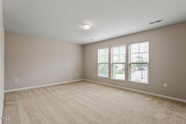 107 Tuftin Dr, Durham, NC 27703 - unfurnished room featuring light colored carpet