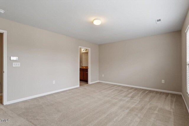 107 Tuftin Dr, Durham, NC 27703 - spare room featuring light carpet and a smoke detector