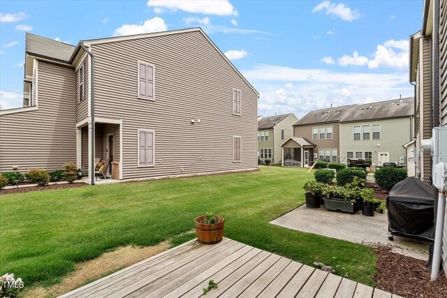 107 Tuftin Dr, Durham, NC 27703 - view of green lawn featuring a patio area and a residential view