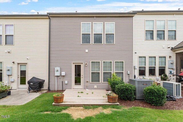 107 Tuftin Dr, Durham, NC 27703 - rear view of property with a patio area and a lawn