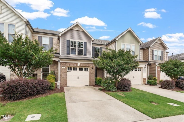 107 Tuftin Dr, Durham, NC 27703 - townhome / multi-family property with an attached garage, concrete driveway, brick siding, and a front lawn