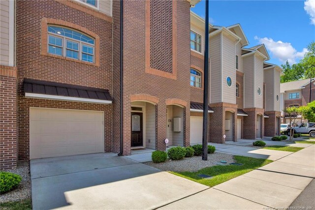 278 Hugh Shelton Loop, Fayetteville, NC 28301 - view of building exterior featuring concrete driveway and a garage