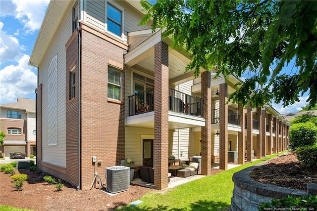 278 Hugh Shelton Loop, Fayetteville, NC 28301 - rear view of property with an outdoor living space, a balcony, brick siding, and a patio