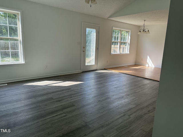 118 Hawthorn Dr, Clayton, NC 27520 - spare room with dark wood-type flooring, baseboards, and lofted ceiling