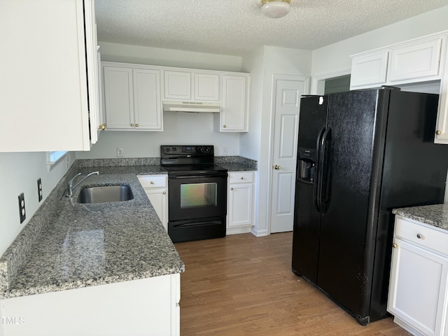 118 Hawthorn Dr, Clayton, NC 27520 - kitchen with white cabinetry, black appliances, under cabinet range hood, and a sink