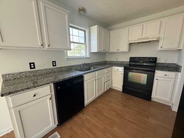 118 Hawthorn Dr, Clayton, NC 27520 - kitchen featuring under cabinet range hood, white cabinetry, a sink, and black appliances