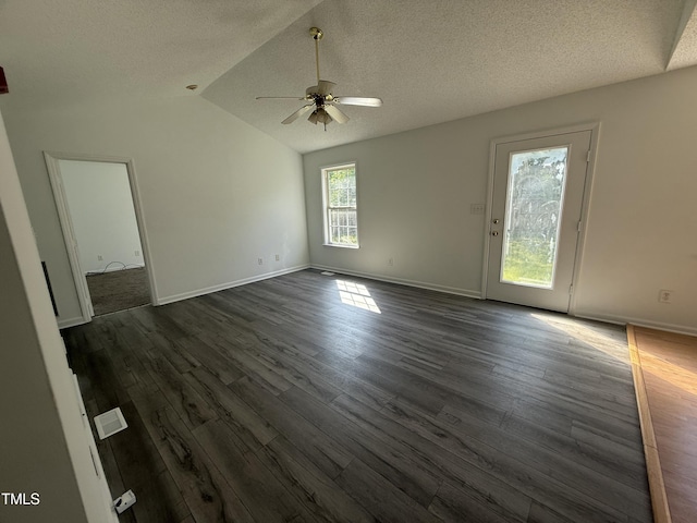 118 Hawthorn Dr, Clayton, NC 27520 - unfurnished living room with ceiling fan, a textured ceiling, dark wood-style flooring, and baseboards