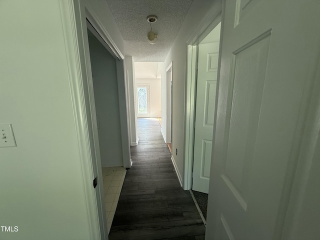 118 Hawthorn Dr, Clayton, NC 27520 - hall featuring dark wood-style flooring and a textured ceiling