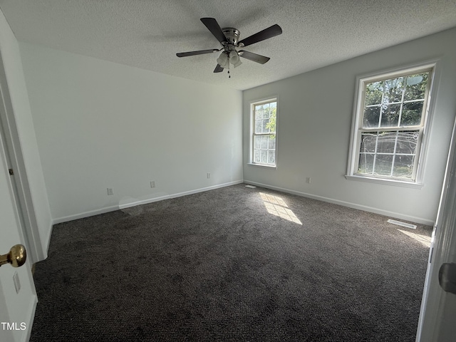 118 Hawthorn Dr, Clayton, NC 27520 - carpeted spare room with a textured ceiling, baseboards, a ceiling fan, and visible vents