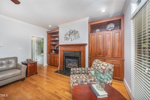 8840 Woodyhill Rd, Raleigh, NC 27613 - living room with light wood-style floors, ornamental molding, a fireplace, and recessed lighting