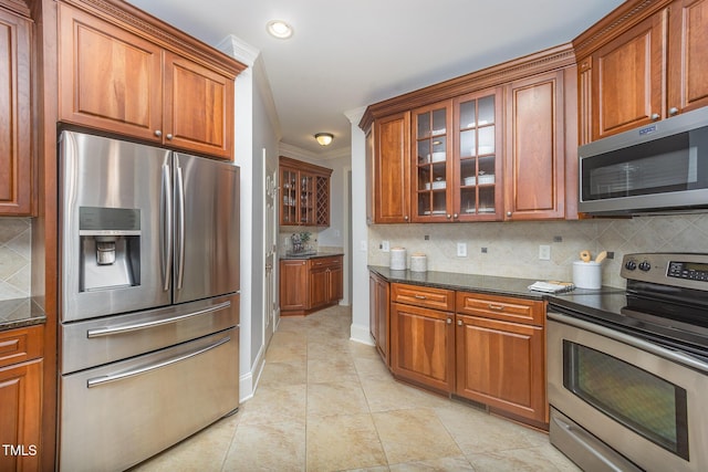 8840 Woodyhill Rd, Raleigh, NC 27613 - kitchen featuring stainless steel appliances, backsplash, brown cabinetry, glass insert cabinets, and crown molding