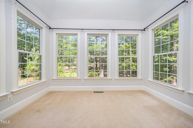8840 Woodyhill Rd, Raleigh, NC 27613 - unfurnished sunroom with carpet floors and baseboards