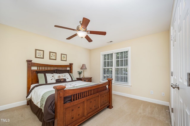 8840 Woodyhill Rd, Raleigh, NC 27613 - bedroom featuring light carpet, baseboards, and ceiling fan