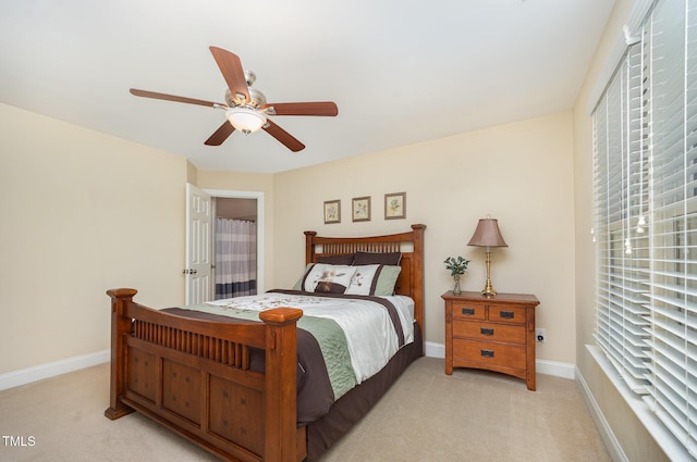 8840 Woodyhill Rd, Raleigh, NC 27613 - bedroom featuring light carpet, baseboards, and ceiling fan