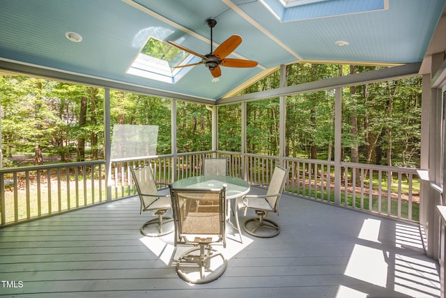 8840 Woodyhill Rd, Raleigh, NC 27613 - sunroom / solarium with a skylight, vaulted ceiling, outdoor dining area, and a ceiling fan