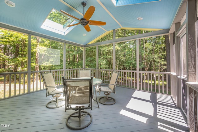 8840 Woodyhill Rd, Raleigh, NC 27613 - sunroom / solarium with a skylight, outdoor dining area, a ceiling fan, vaulted ceiling, and plenty of natural light