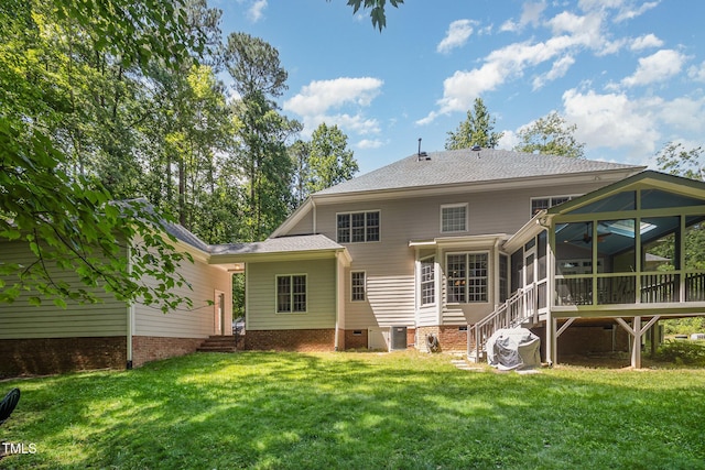 8840 Woodyhill Rd, Raleigh, NC 27613 - back of house featuring a sunroom, a yard, crawl space, and central AC unit