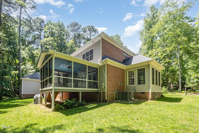 8840 Woodyhill Rd, Raleigh, NC 27613 - back of house featuring a sunroom, a lawn, a ceiling fan, and crawl space