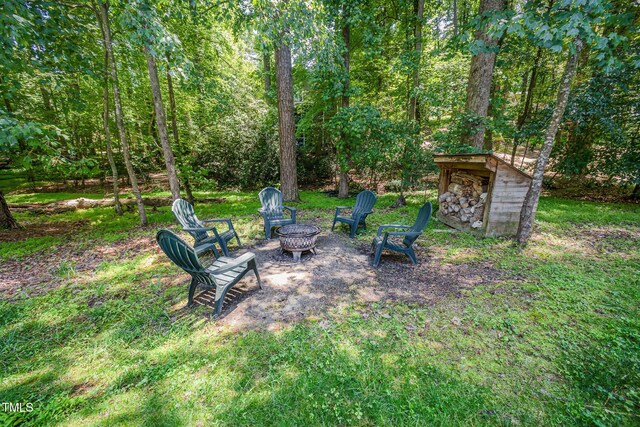 8840 Woodyhill Rd, Raleigh, NC 27613 - view of yard featuring a fire pit