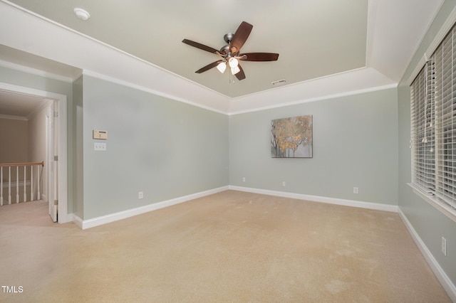 8840 Woodyhill Rd, Raleigh, NC 27613 - unfurnished room with light carpet, ceiling fan, crown molding, a tray ceiling, and a smoke detector