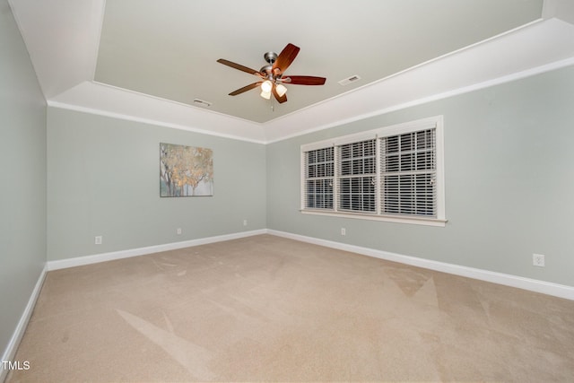 8840 Woodyhill Rd, Raleigh, NC 27613 - carpeted empty room with a ceiling fan, baseboards, and a raised ceiling