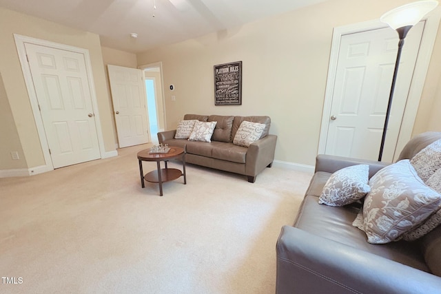 8840 Woodyhill Rd, Raleigh, NC 27613 - living room featuring light carpet and ceiling fan