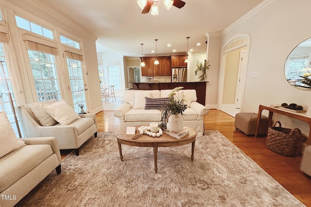 8840 Woodyhill Rd, Raleigh, NC 27613 - living room featuring crown molding, a ceiling fan, and wood finished floors