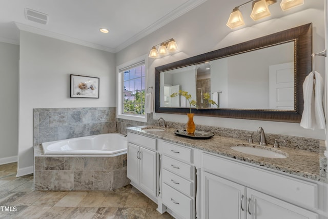 bathroom featuring visible vents, ornamental molding, a sink, and a bath