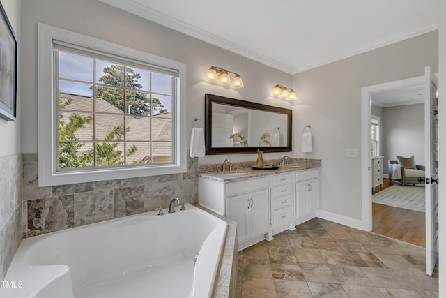 bathroom with crown molding, a washtub, a sink, and double vanity