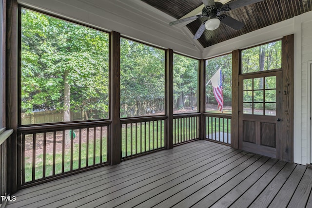 unfurnished sunroom featuring ceiling fan