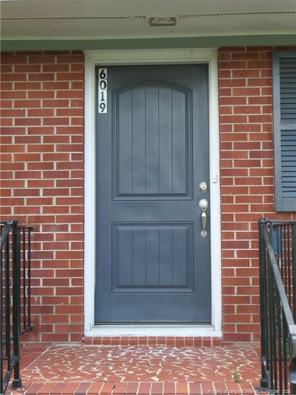 6019 S US Highway 301, Hope Mills, NC 28348 - property entrance with brick siding