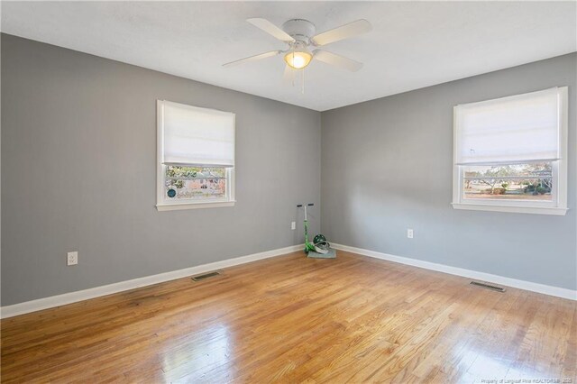 6019 S US Highway 301, Hope Mills, NC 28348 - spare room with a healthy amount of sunlight, light wood-style flooring, and visible vents