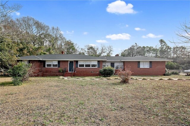 6019 S US Highway 301, Hope Mills, NC 28348 - single story home with brick siding, a chimney, and entry steps
