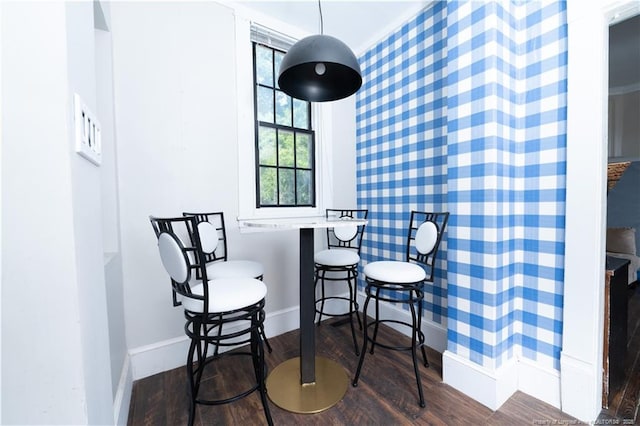 236 E Andrews Ave, Henderson, NC 27536 - dining room with baseboards, wood finished floors, and wallpapered walls