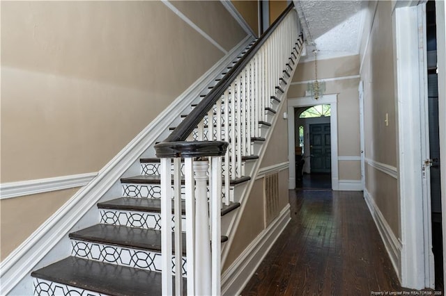 236 E Andrews Ave, Henderson, NC 27536 - stairway with baseboards, hardwood / wood-style flooring, and visible vents