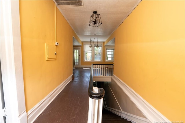 236 E Andrews Ave, Henderson, NC 27536 - hall featuring baseboards, an upstairs landing, dark wood-style flooring, and visible vents