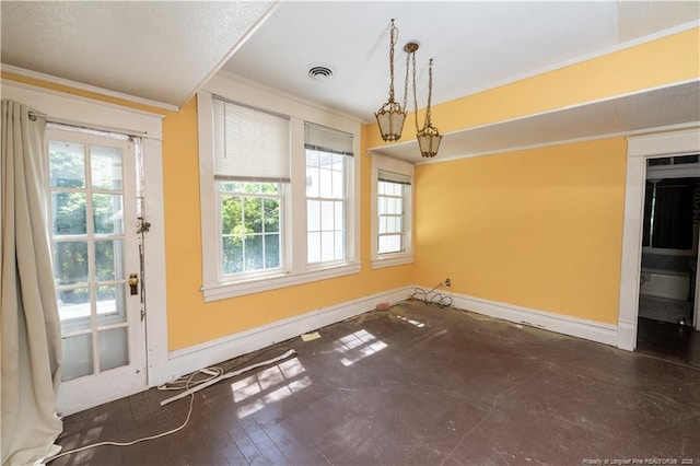 236 E Andrews Ave, Henderson, NC 27536 - unfurnished dining area featuring baseboards, ornamental molding, and visible vents