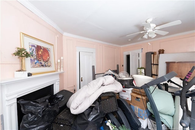 236 E Andrews Ave, Henderson, NC 27536 - bedroom with crown molding, a ceiling fan, and a fireplace