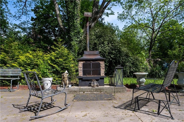 236 E Andrews Ave, Henderson, NC 27536 - view of patio / terrace with an outdoor stone fireplace