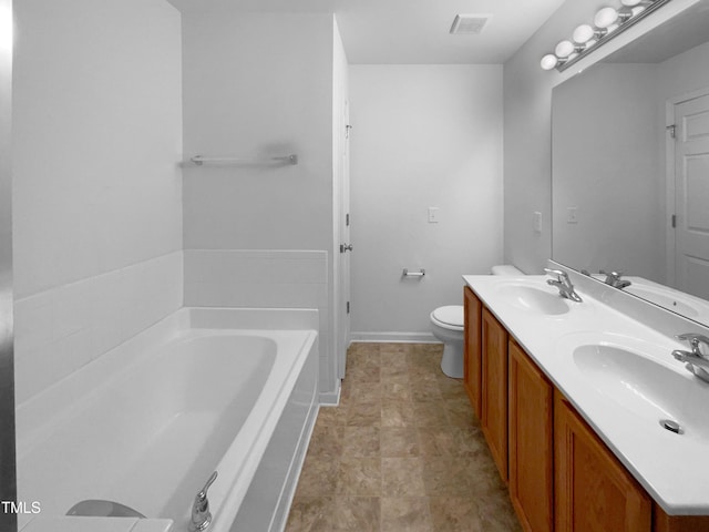 full bathroom featuring toilet, visible vents, a sink, and a garden tub