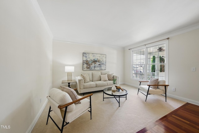 living room featuring crown molding, baseboards, and wood finished floors