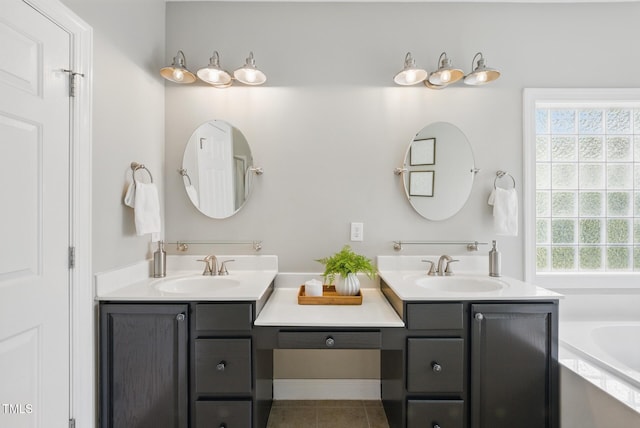 bathroom featuring vanity, tile patterned flooring, and a garden tub