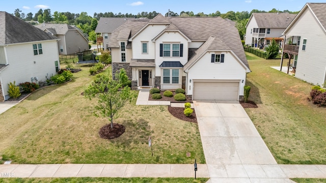 912 Beech Glen Dr, Mebane, NC 27302 - traditional-style house featuring driveway, a residential view, a trampoline, and stone siding