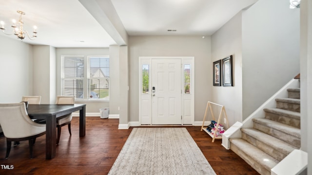 912 Beech Glen Dr, Mebane, NC 27302 - entrance foyer with visible vents, stairs, baseboards, dark wood finished floors, and a notable chandelier