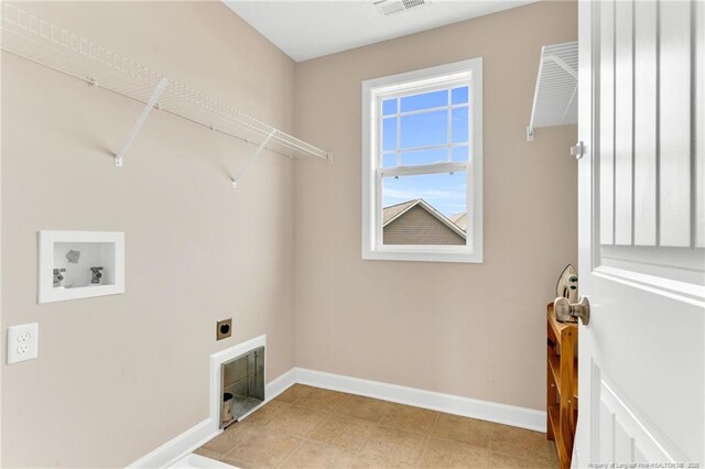 laundry area with laundry area, visible vents, baseboards, hookup for a washing machine, and electric dryer hookup