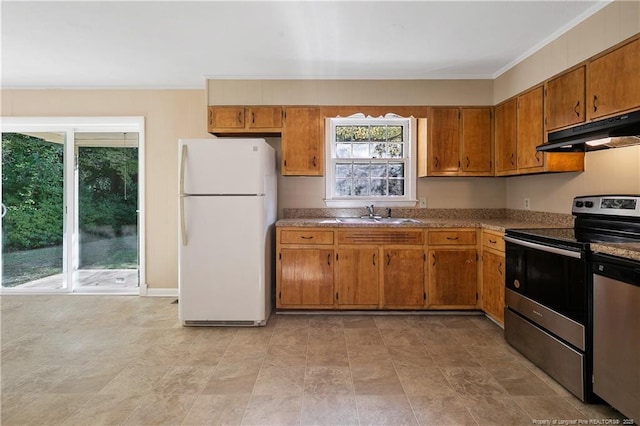 1001 Arberdale, Fayetteville, NC 28304 - kitchen featuring under cabinet range hood, appliances with stainless steel finishes, brown cabinetry, and a sink