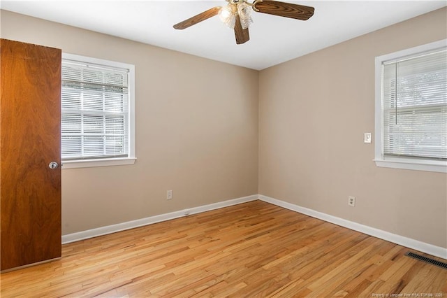 1001 Arberdale, Fayetteville, NC 28304 - unfurnished room featuring baseboards, a ceiling fan, a wealth of natural light, and light wood-type flooring