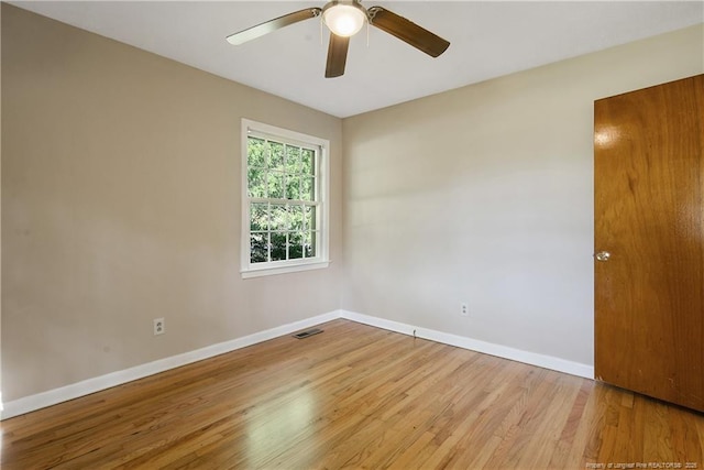 1001 Arberdale, Fayetteville, NC 28304 - unfurnished room with visible vents, baseboards, ceiling fan, and wood finished floors