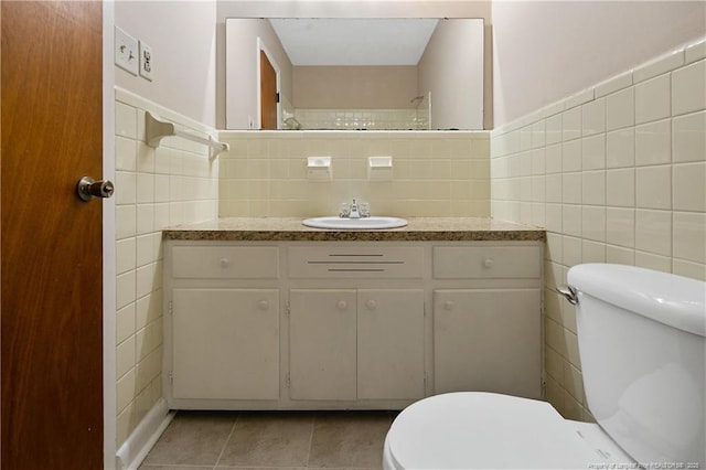 1001 Arberdale, Fayetteville, NC 28304 - bathroom with tile walls, tile patterned flooring, vanity, and toilet